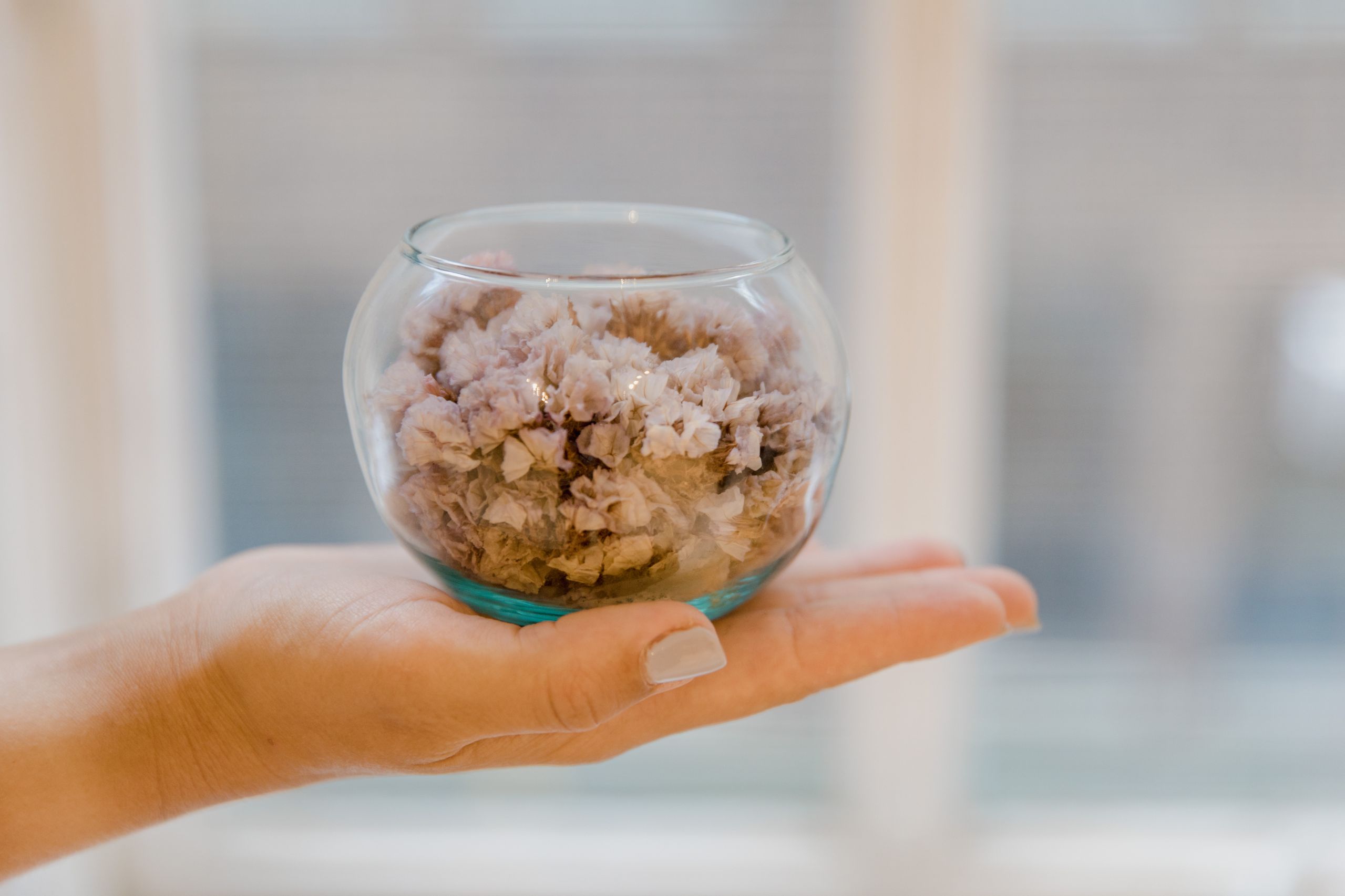 Vase with dried flowers and small bowl